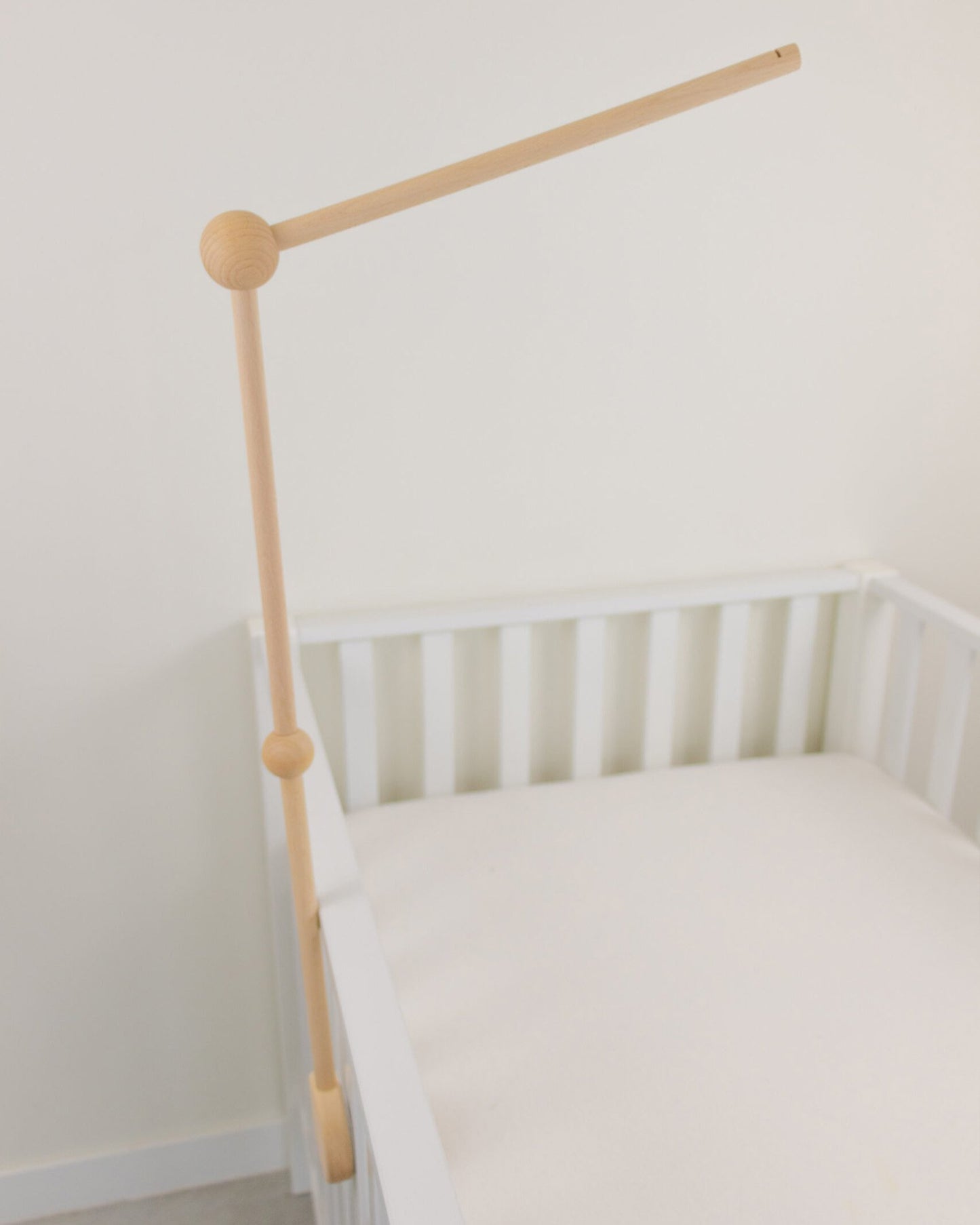 Wooden baby mobile arm fixed